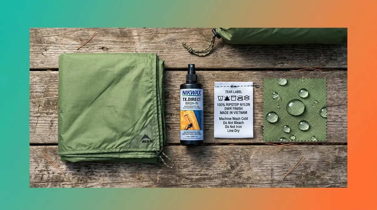 Camping gear flat lay with tent rainfly, waterproofing spray bottle, and fabric care label for buying guide