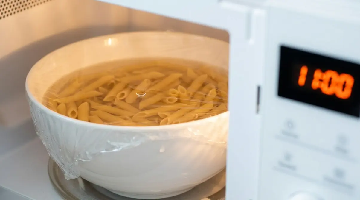 How To Cook Pasta Quickly: 6 Speed Methods Ranked 8 Microwave pasta method with covered bowl showing how to cook pasta quickly without a stovetop