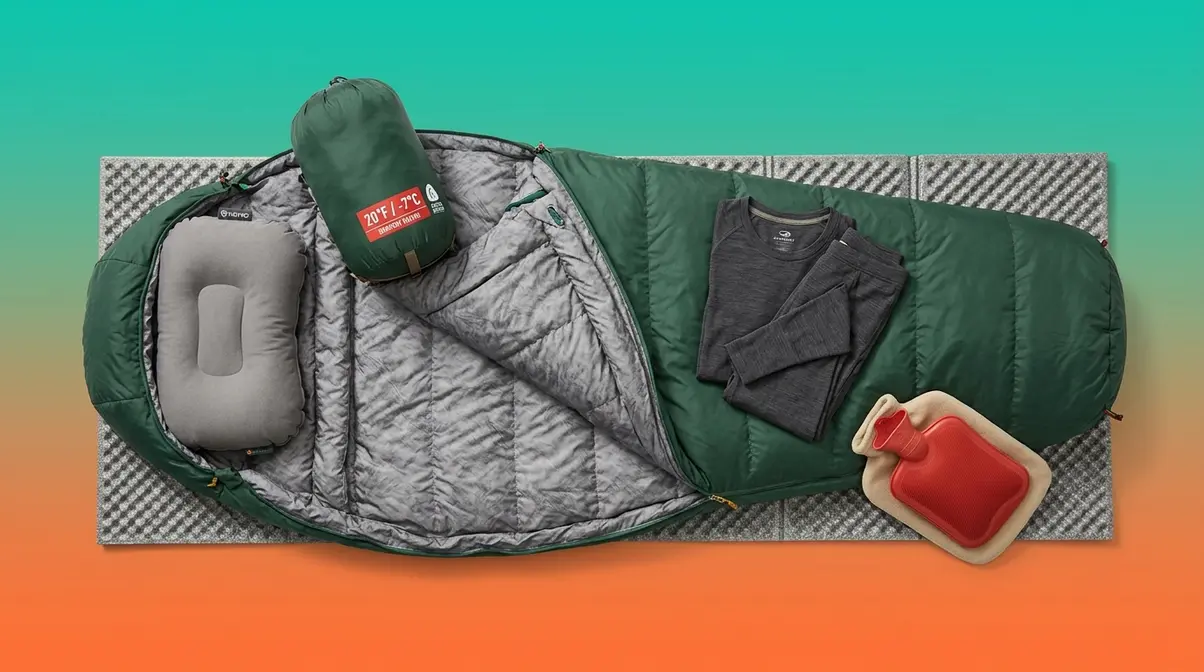 Complete tent sleep system with mummy sleeping bag, camp pillow, base layer, and hot water bottle