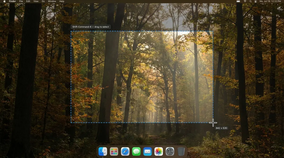 Mac screenshot crosshair cursor with blue selection box showing Shift-Command-4 area selection on macOS Sequoia