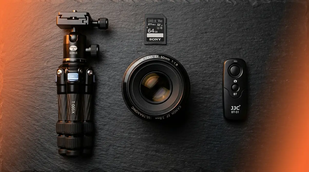 Low light photography gear including fast 50mm prime lens tripod and memory card