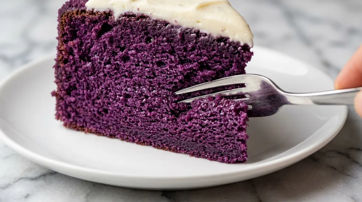 Purple Velvet Cake Recipe: Moist, Easy &Amp; Step-By-Step 10 Close-up of moist purple velvet cake crumb texture showing tender fine interior with cream cheese frosting edge