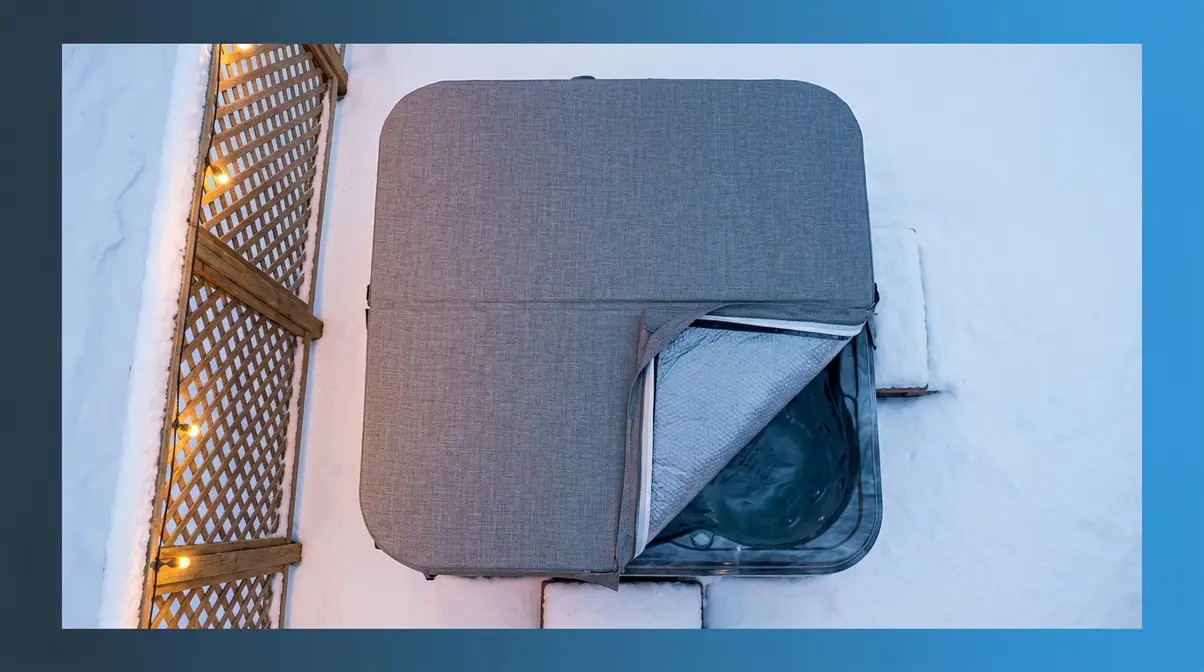 Hot tub with insulated foam cover and floating thermal blanket in place during winter for energy efficiency